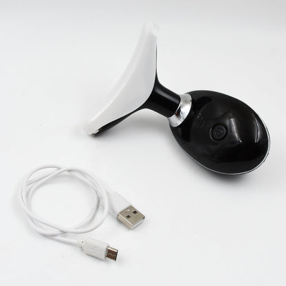 The portable Neck Face Massager shown with its USB charging cable.