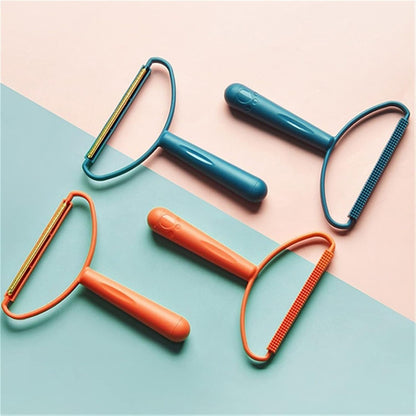 Efficient portable lint remover being used on a cozy wool sweater to remove pilling and fuzz.