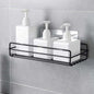 Stainless steel wall mount bathroom shelf holding toiletries.