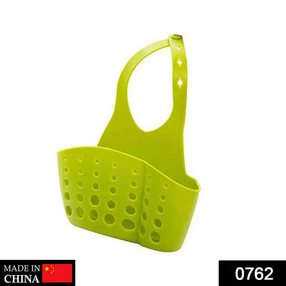 Versatile sink caddy with drainage holes holding a sponge and brush.