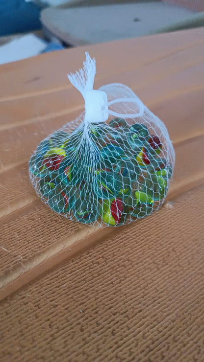 Detailed close-up of glass marbles with vibrant swirl patterns for play and crafts