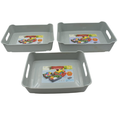 Compact plastic trays used for organizing cosmetics and stationery on a desk