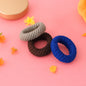 Tyre shape multicolour hair bands in a pack of three, displayed for women.