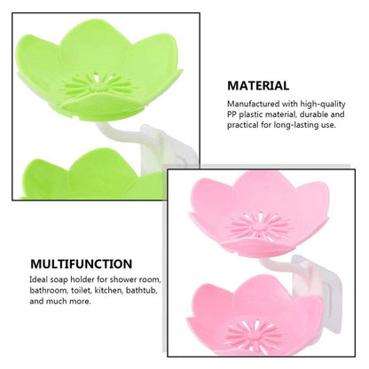 Flower-shaped self-draining soap dish displayed on a countertop next to a sink.