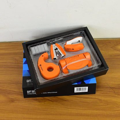 Close-up of tape dispenser and staple remover in gift set