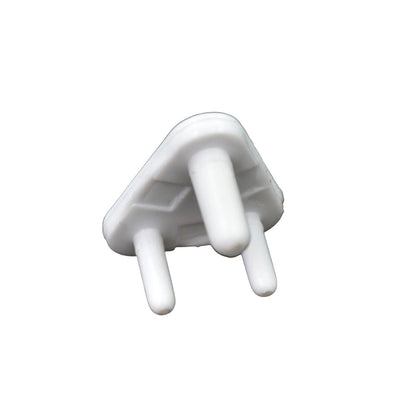 A child's hand reaching towards a covered electrical socket, demonstrating the protection of baby socket covers.