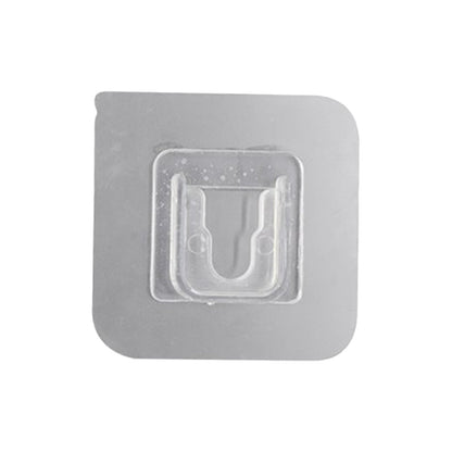 Transparent self-adhesive wall hook ready for easy peel-and-stick application.