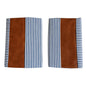 Pair of leather and cotton pillow covers on a modern sofa