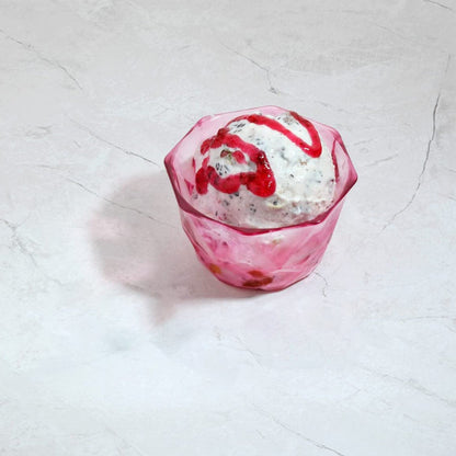 Clear plastic dessert bowls, ready for serving sweet treats.