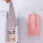 Wall hanging laundry basket for dirty clothes, ideal for bathroom organisation.