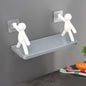 An elegant floating wall shelf in a modern living room, displaying decorative items.