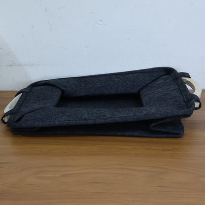 Folded pet toy storage basket, demonstrating its space-saving collapsible design.