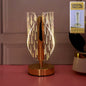 Elegant crystal-effect LED table lamp illuminating bedside table