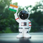 Solar powered astronaut ornament with Indian flag waving hand on car dashboard