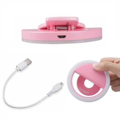 Selfie ring light mounted on a mini tripod stand, ideal for videos and streaming.