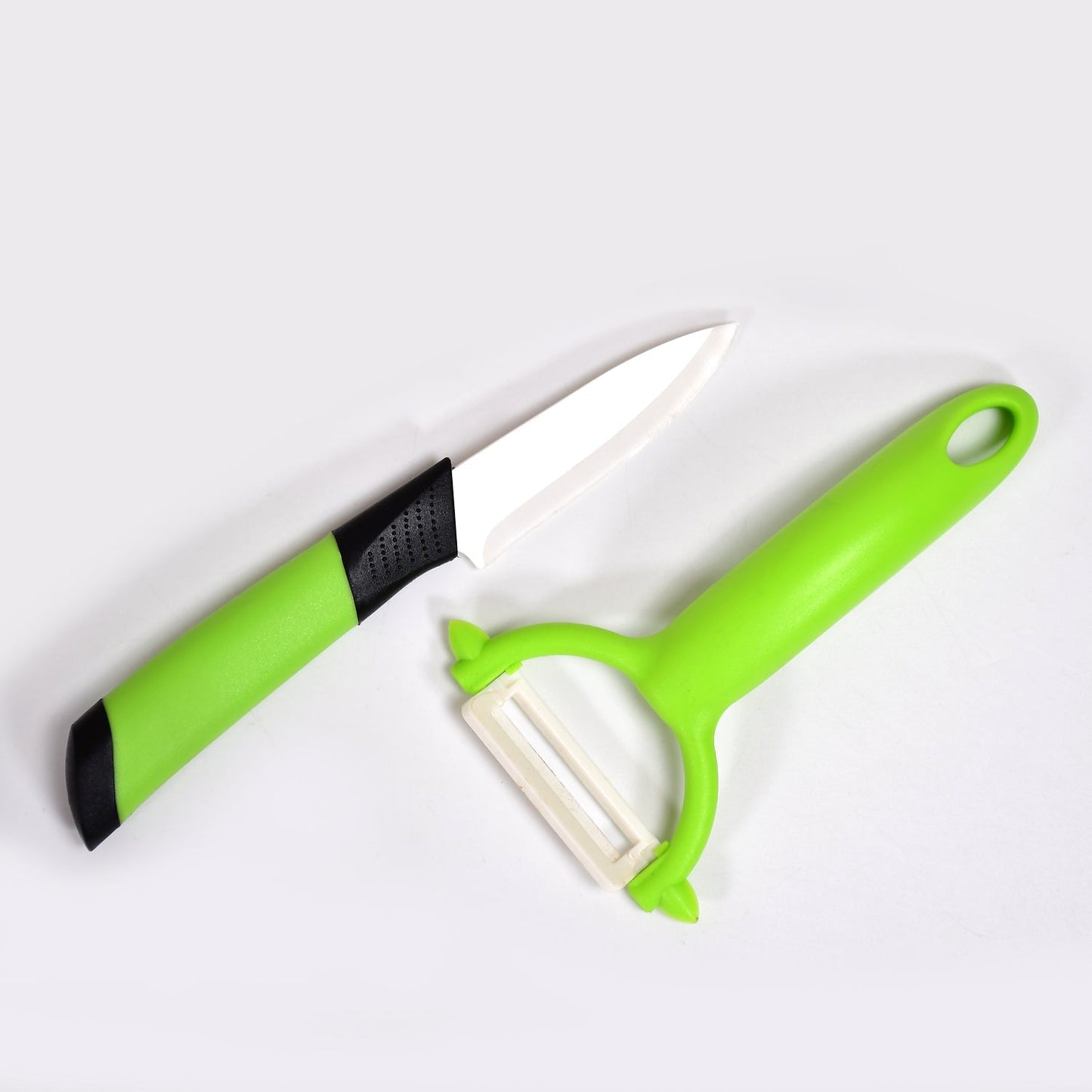Ergonomic ceramic peeler with a non-reactive blade, perfect for fresh fruits and vegetables.