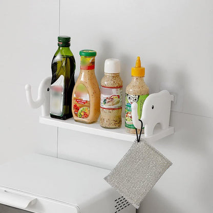 No-punch elephant wall shelf providing storage in a modern bathroom.