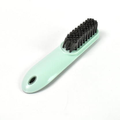 The versatile household scrubber shown with water, ready for deep cleaning.