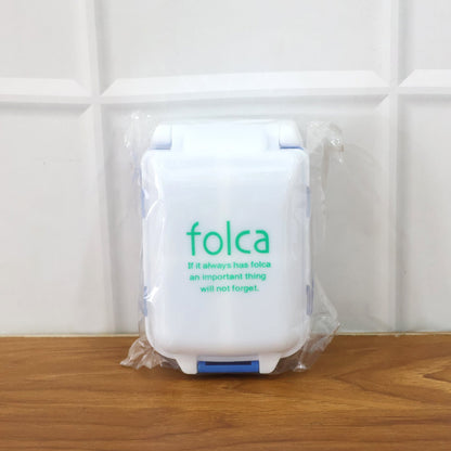 Blue portable pill organizer with secure lids