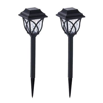 FitFuzion solar pathway lights casting bright, artistic patterns on a dark garden path, enhancing outdoor decor.