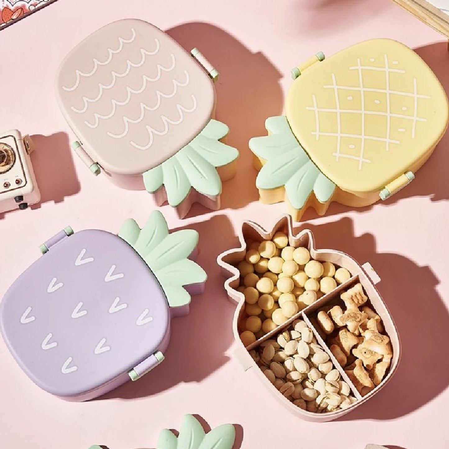 Closed pineapple shaped kids bento lunch box ready for school.