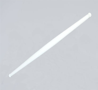 Clean white plastic rolling pin resting on a modern kitchen countertop, ready for use.