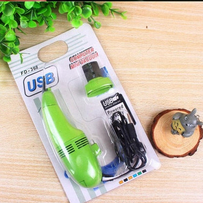 Effective USB mini vacuum cleaner for removing dust and debris from car interiors and keyboards.
