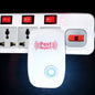 A white ultrasonic pest repeller with a blue indicator light is plugged into a white power strip with red switches.