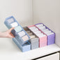 Clear plastic organizer tray with multiple compartments for beads and small craft items.