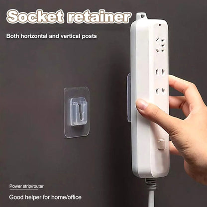 Set of white plastic adhesive hooks neatly arranged on a wall.