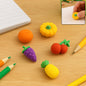 A diverse set of colorful 3D fancy erasers for kids in various shapes and designs.