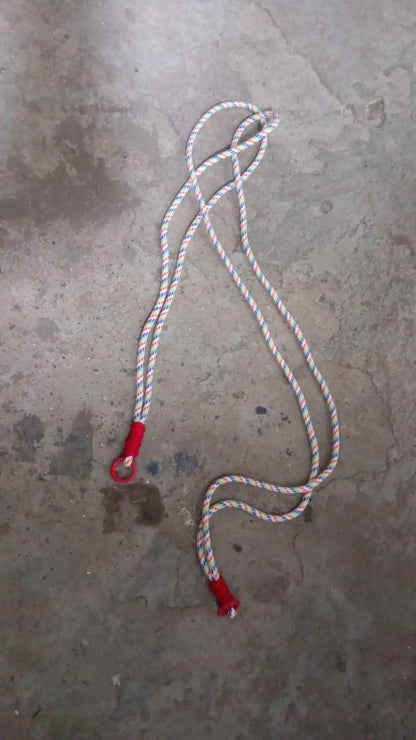 Lifestyle image showing a smartphone easily accessible via its phone lanyard from a bag.