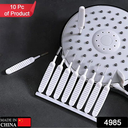 A reusable shower nozzle cleaning brush demonstrating its flexible nylon spiral head.