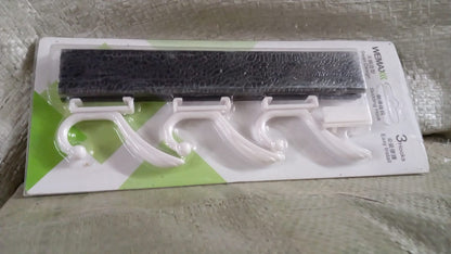 Detail view of the durable metal hooks and wooden board of the GlimmerHome coat rack