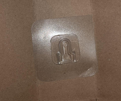 Transparent adhesive hooks neatly packaged for safe delivery.
