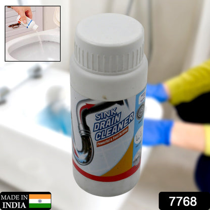 Clog remover powder being poured into a kitchen sink drain for effective cleaning.