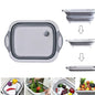 Foldable chopping board in use, converting to a dish rack for washing vegetables.