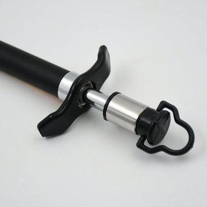 Close-up of the stainless steel gas lighter producing a reliable spark for ignition.