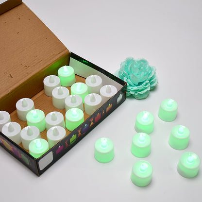 A pack of 24 green flameless LED tealights ready for use.