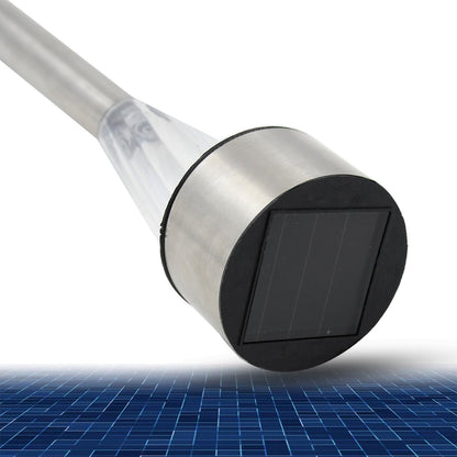 A close-up view of the solar panel on the silver cap of the LED spike light, with a blue grid pattern below.