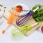 Ergonomic plastic balloon whisk for milk, coffee, and egg mixing by Quickslice.