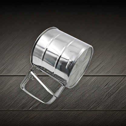 Side view of the durable flour sifter, highlighting its sturdy construction.