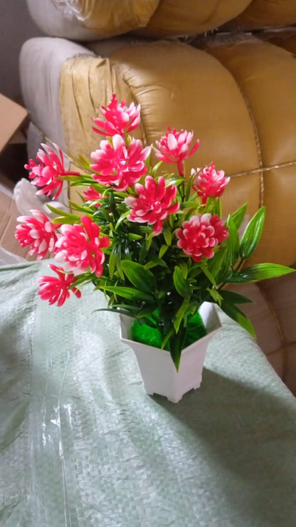An artificial flower plant in a stylish pot, ready to enhance your home office decor.