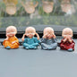 Adorable Baby Buddha showpiece set with four monk statues, perfect for home decor.