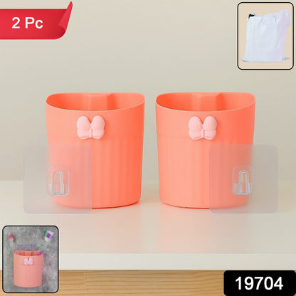 Two-piece set of wall-mounted toothbrush holders featuring butterfly design in original packaging