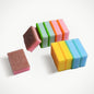 Stack of vibrant, multi-purpose dish cleaning sponges for kitchen use.