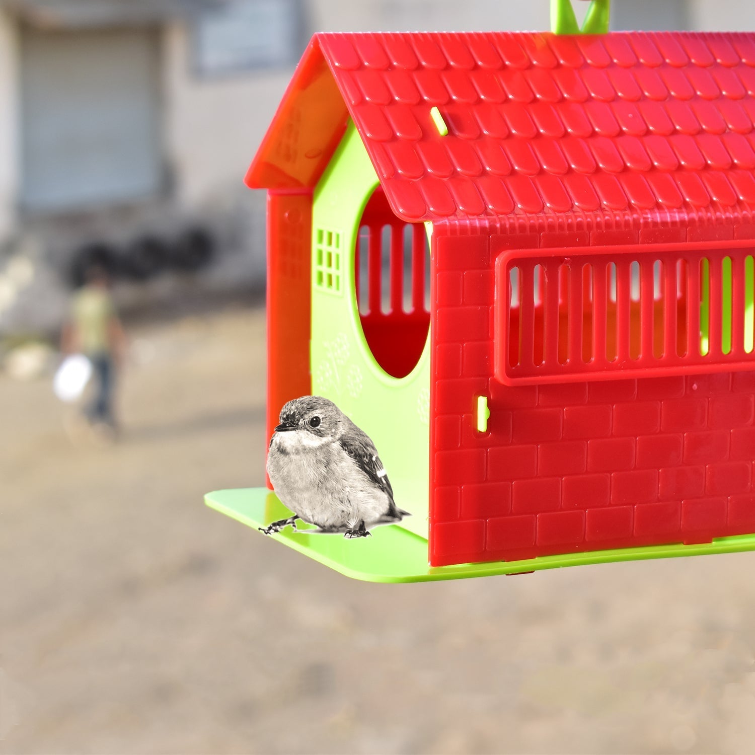 Front view of a rustic wooden bird house with a small entrance hole, perfect for small garden birds.