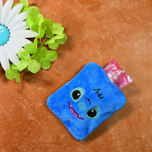 Small blue hot water bag with a soft fabric cover, perfect for pain relief.