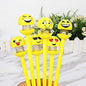 A set of vibrant emoji ballpoint pens, perfect for adding fun to schoolwork.