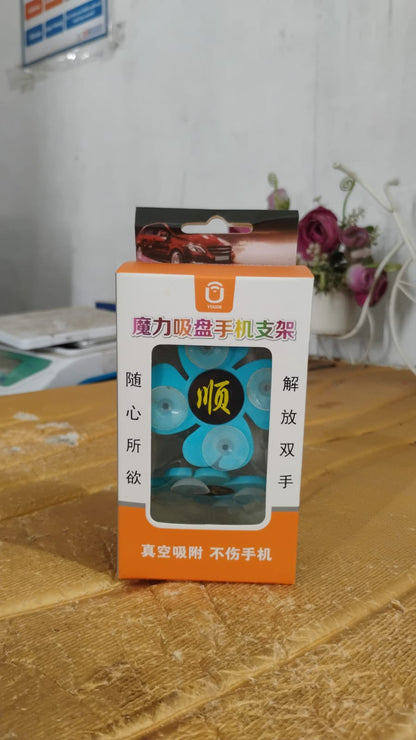 Flower shape car phone holder also functioning as a desktop stand for mobile devices.